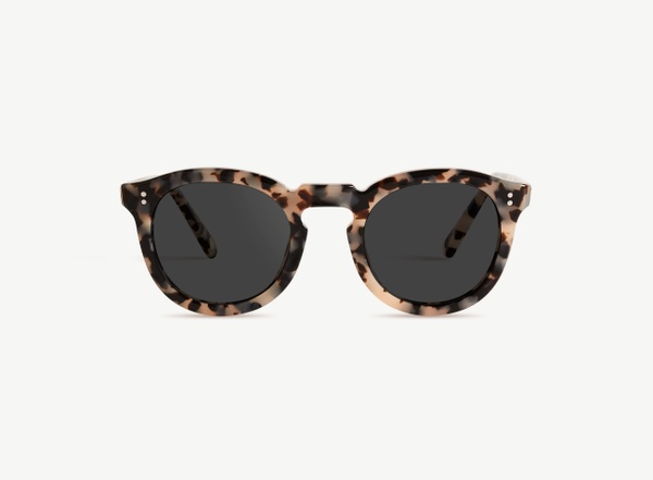 Front view of a pair of eyeglasses called the Charmer in Latte