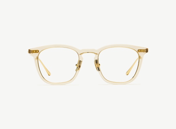 Front view of a pair of eyeglasses called the Trader in Nude
